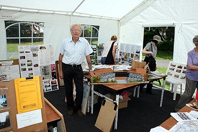 Photograph taken by Paul Bexon at the Society's exhibition held as part of the Lenton Festival 13 June 2009.  Society member, Derrick Norris, poses with his model of the bridge over the Nottingham canal which once provided pedestrian access between Leengate and Spring Close.